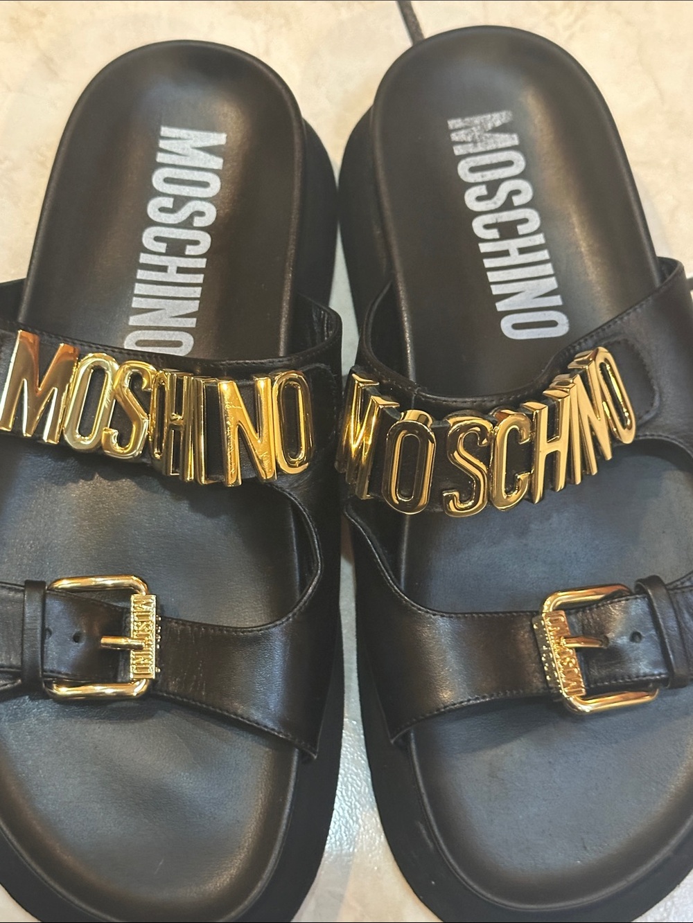 Moschino Black Leather Slides with Gold Logo Hardware